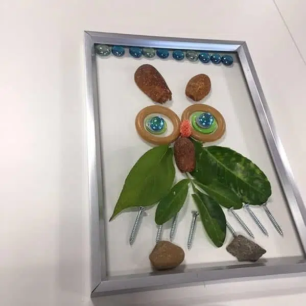 A transient art picture of an owl in a picture frame