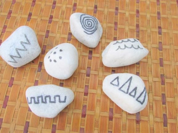 This image has an empty alt attribute; its file name is 41-mark-making-stones.jpg
