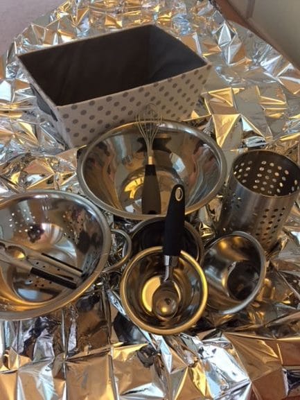 Silver pots and pans for emptying and tipping