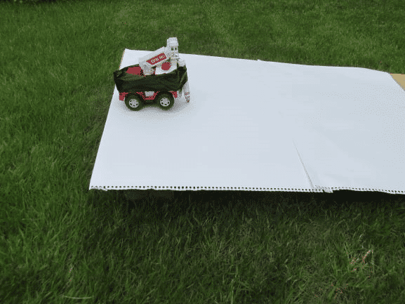 Ramp with toy car with pen attached