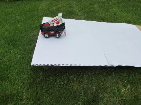 A ramp with a toy vehicle on it