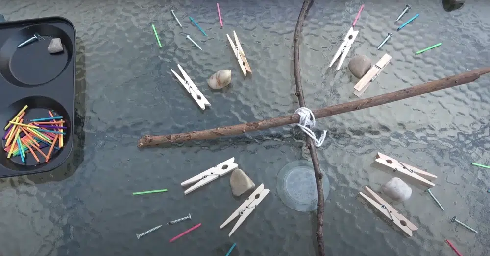 Stick cross mandala with loose parts