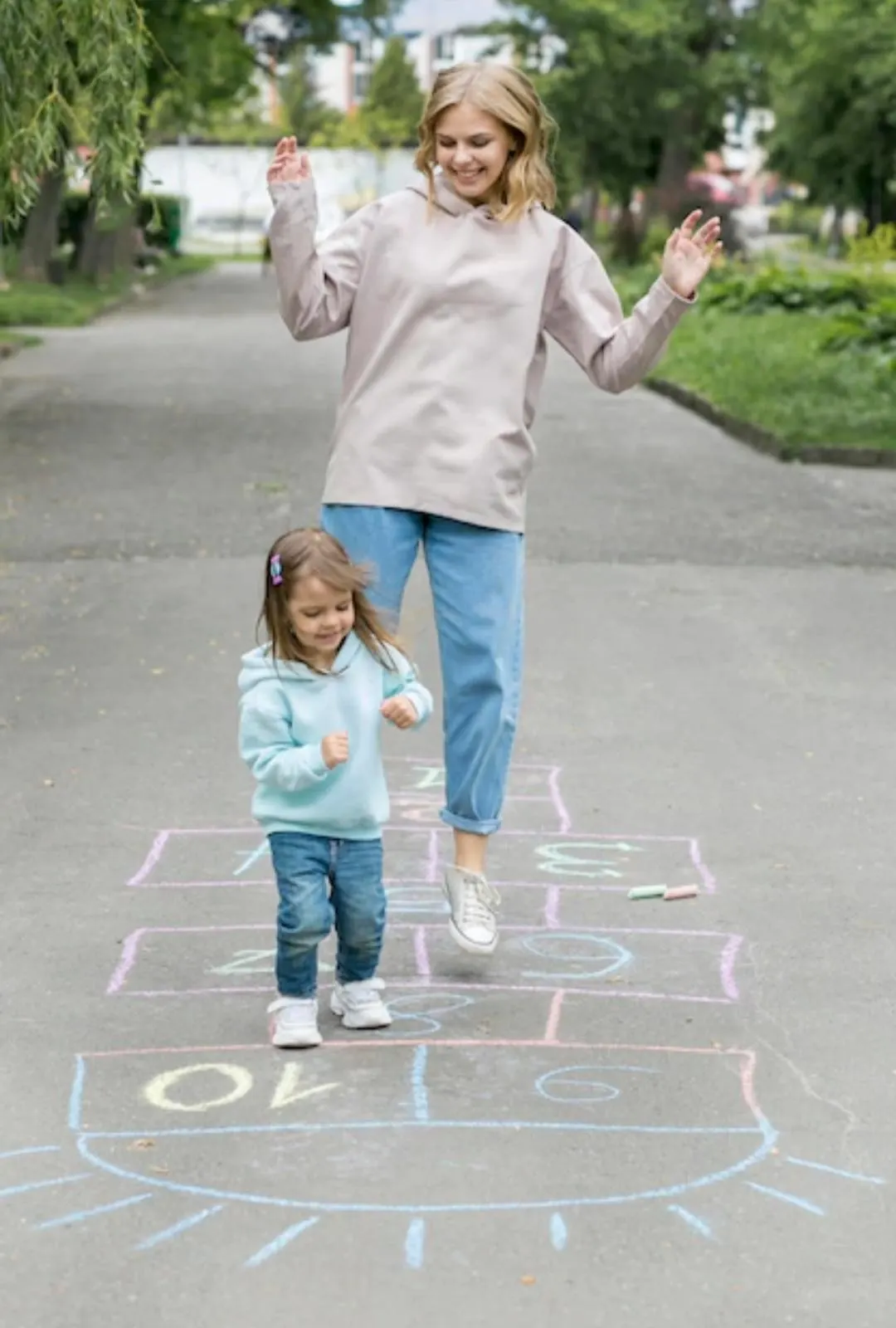 mom and daughter playing hopscotch