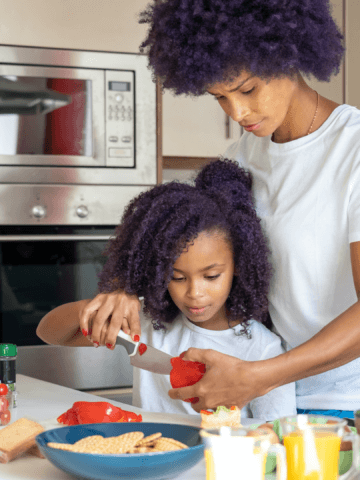 a woman preparing food with her daughter - taste test activities for preschool