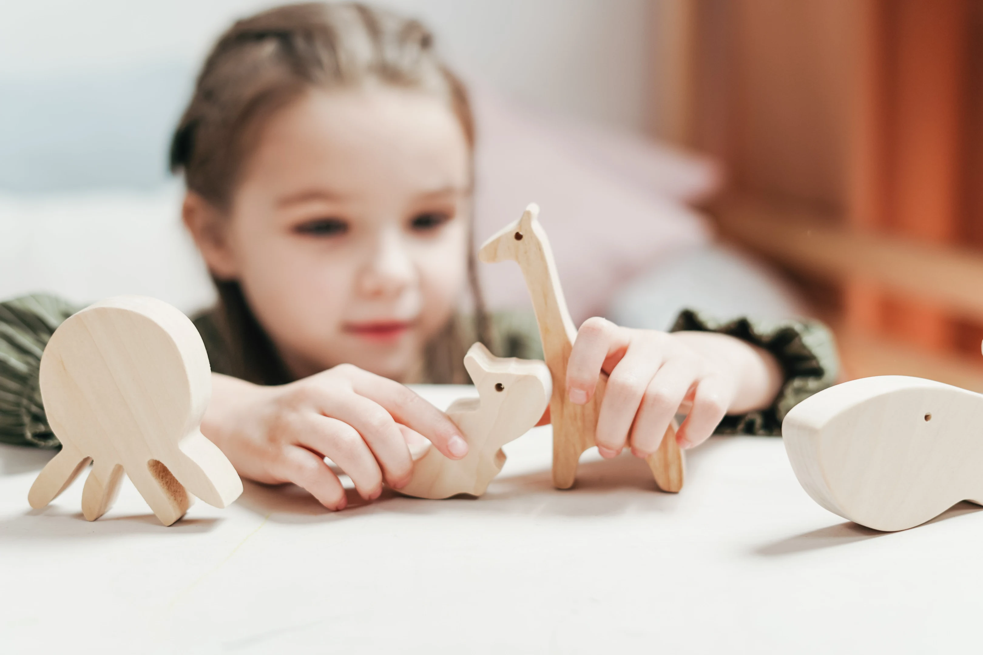 girl with wooden toys