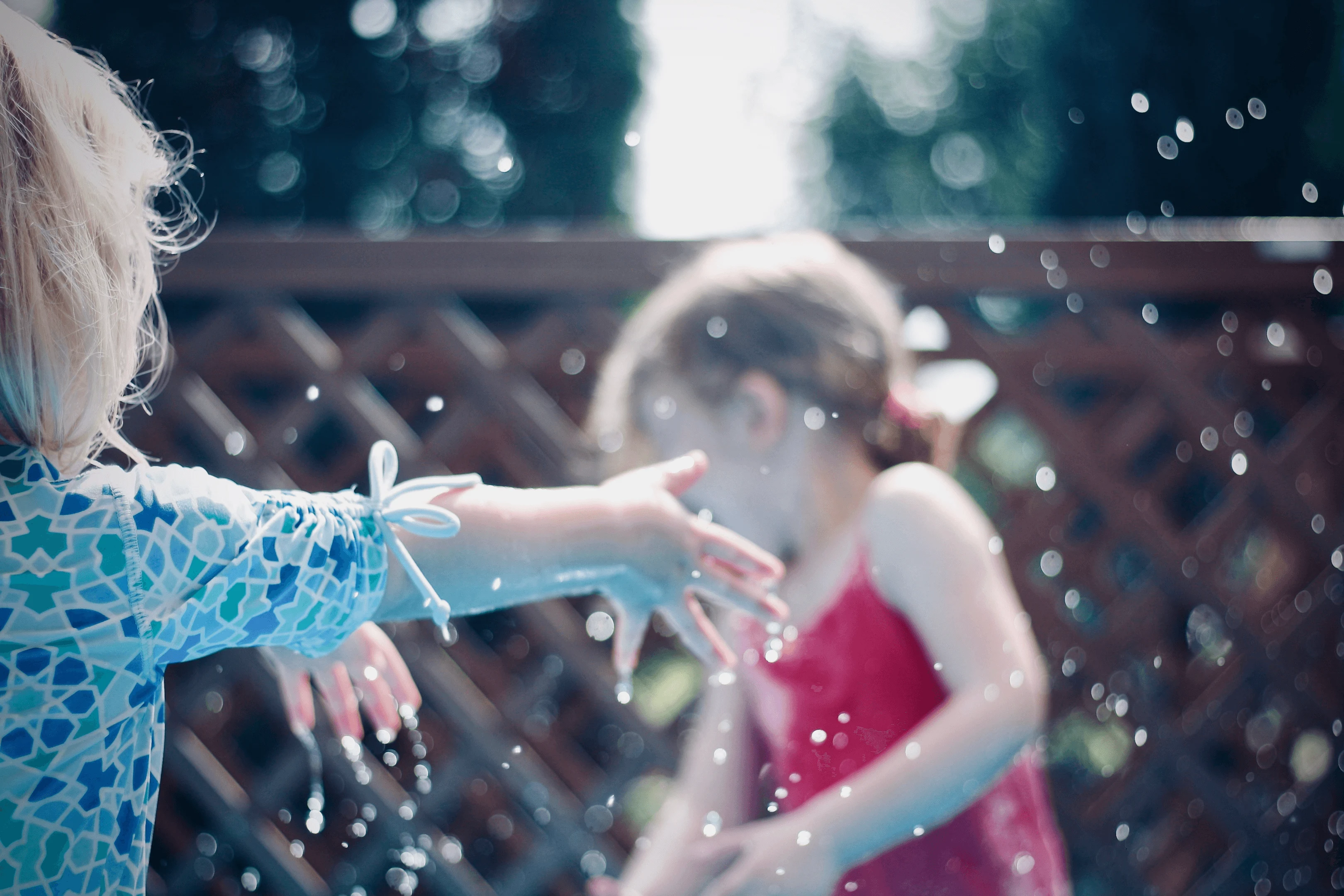 Trajectory play schema - two kids playing with water