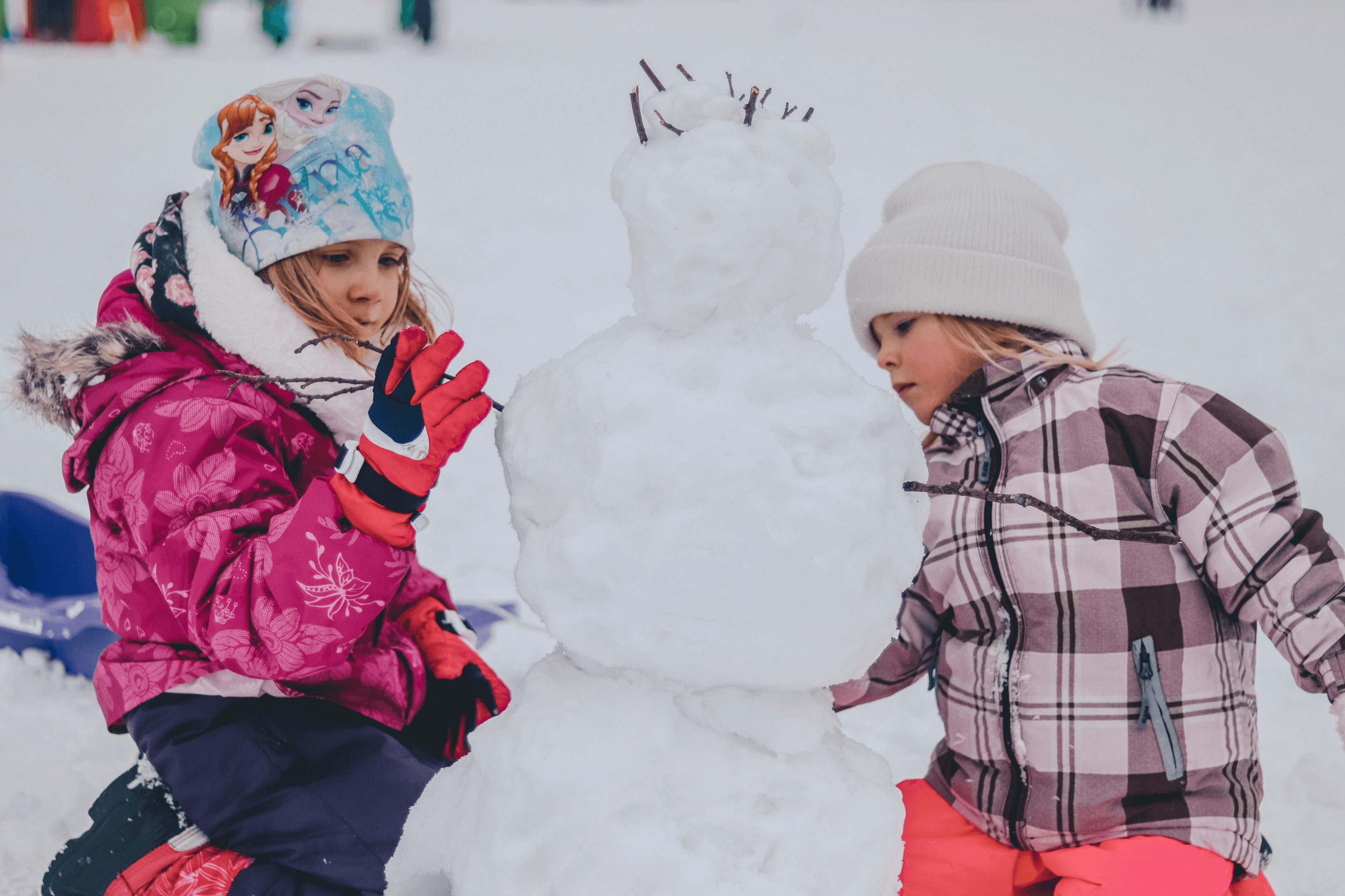 kids building a snowman