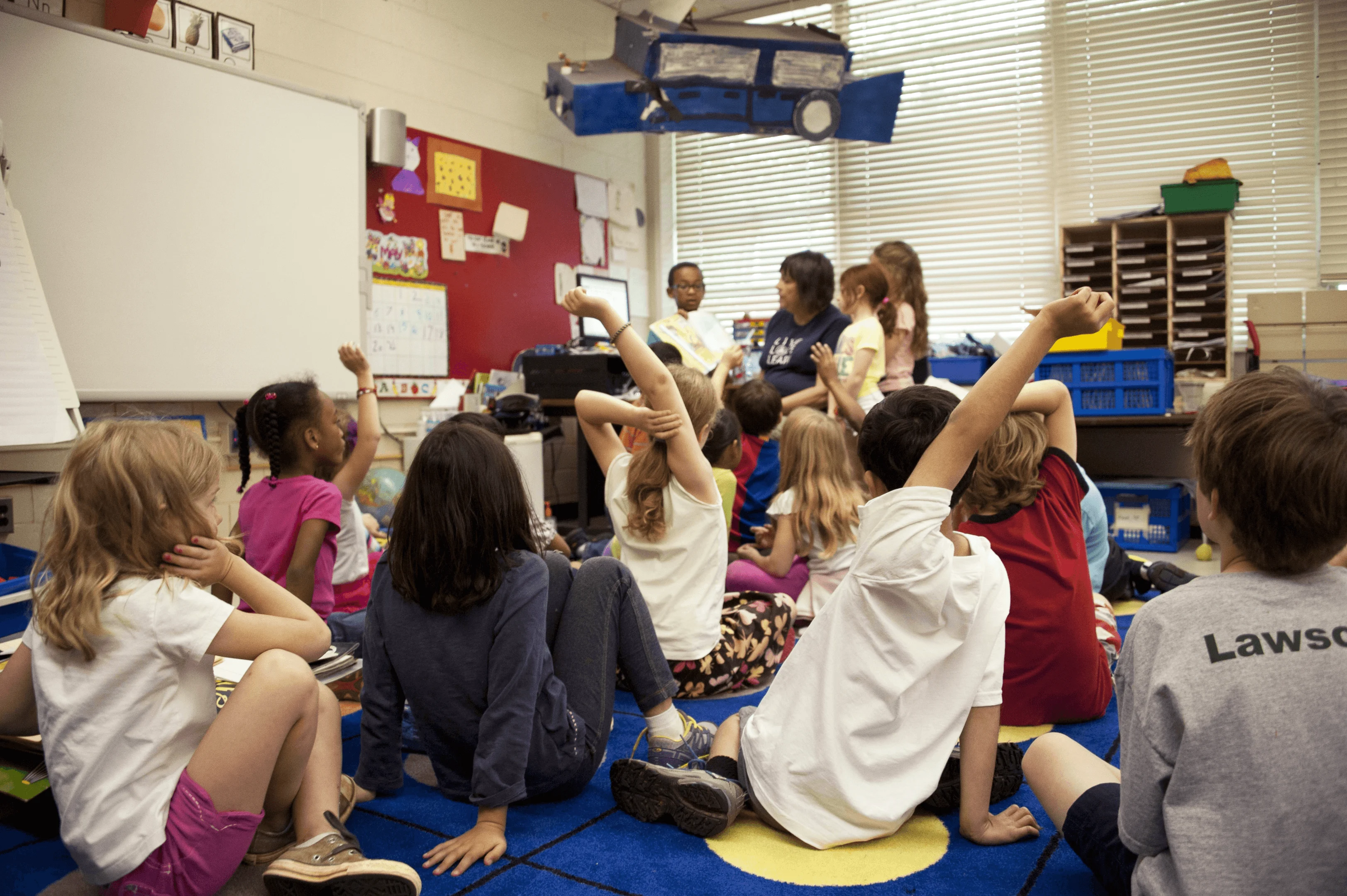 kids and teacher in a classroom 